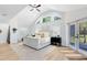Bright bedroom with hardwood floors, a vaulted ceiling, and a walkout patio at 840 Dyson Dr, Winter Springs, FL 32708