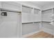 Spacious walk-in closet with custom shelving, providing ample storage for clothing and accessories at 1000 Farmstead St, Eustis, FL 32736