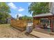 Backyard with deck featuring a pool, covered patio, and detached shed at 1010 Chokecherry Dr, Winter Springs, FL 32708