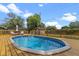 Backyard pool and deck with lounge chairs at 1010 Chokecherry Dr, Winter Springs, FL 32708