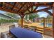 Backyard features a covered outdoor dining area, deck with lounge chairs, and a pool for relaxation at 1010 Chokecherry Dr, Winter Springs, FL 32708
