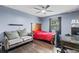 Modern bedroom featuring wood-look floors, stylish furniture, and large window at 1010 Chokecherry Dr, Winter Springs, FL 32708