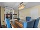 Dining room with dark wood floors, statement chandelier, and access to the kitchen at 1010 Chokecherry Dr, Winter Springs, FL 32708