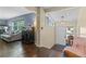 Bright living room with hardwood floors, large windows, and a decorative aquarium, great for entertaining at 1010 Chokecherry Dr, Winter Springs, FL 32708