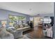 Inviting living room with comfortable seating, hardwood floors, and a sunny window offering pleasant views at 1010 Chokecherry Dr, Winter Springs, FL 32708