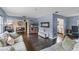 Inviting living room offers open space with hardwood floors, modern decor, and a glimpse into the kitchen at 1010 Chokecherry Dr, Winter Springs, FL 32708