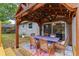 Covered patio with dining table and chairs, offering a perfect outdoor living space at 1010 Chokecherry Dr, Winter Springs, FL 32708