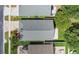Aerial view of gray roof, green yard, and paving stone driveway of a well-maintained single-Gathering home at 10621 Golden Cypress Ct, Orlando, FL 32836