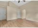 Neutral bedroom with high ceilings, hardwood floors, and several doors at 10621 Golden Cypress Ct, Orlando, FL 32836