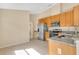 Well-equipped kitchen featuring stainless steel appliances, ample cabinetry, and granite counters for style and functionality at 10621 Golden Cypress Ct, Orlando, FL 32836