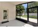 Screened patio with view of fenced yard and paver patio at 10621 Golden Cypress Ct, Orlando, FL 32836