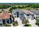 Stunning aerial view of a residential neighborhood with lush green spaces and serene surroundings at 1080 E Jack Nicklaus Ct, Kissimmee, FL 34747
