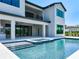 Exterior shot of the house showing the pool, spa and outdoor kitchen at 1080 E Jack Nicklaus Ct, Kissimmee, FL 34747