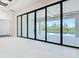 Bright living room showcasing glass doors opening to the covered patio and beautiful pool at 1080 E Jack Nicklaus Ct, Kissimmee, FL 34747