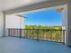 A large balcony with beautiful, green golf course views under a clear blue sky at 1080 E Jack Nicklaus Ct, Kissimmee, FL 34747