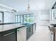 Open kitchen layout with double islands, stainless steel appliances and a seamless transition to the outdoor pool area at 1080 E Jack Nicklaus Ct, Kissimmee, FL 34747