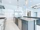 Bright, open kitchen featuring modern appliances, sleek cabinets, and a stylish kitchen island with countertop at 1080 E Jack Nicklaus Ct, Kissimmee, FL 34747