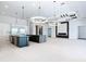 Expansive modern kitchen with double islands, stainless steel appliances and decorative ceiling and lighting fixtures at 1080 E Jack Nicklaus Ct, Kissimmee, FL 34747