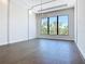 Bright living room with dark wood floors, modern chandelier, and large window with scenic view at 1080 E Jack Nicklaus Ct, Kissimmee, FL 34747