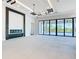 Open living area featuring a modern fireplace, modern ceiling and large sliding glass doors at 1080 E Jack Nicklaus Ct, Kissimmee, FL 34747