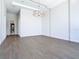 Bright living room with dark wood floors, modern chandelier, and large window with scenic view at 1080 E Jack Nicklaus Ct, Kissimmee, FL 34747
