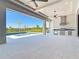 Spacious outdoor living area with a full outdoor kitchen and a view of the beautiful swimming pool at 1080 E Jack Nicklaus Ct, Kissimmee, FL 34747