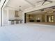 Spacious outdoor area with a full kitchen and views of the spacious kitchen inside at 1080 E Jack Nicklaus Ct, Kissimmee, FL 34747