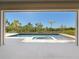Outdoor pool area with jacuzzi surrounded by a spacious tiled patio and lush landscaping at 1080 E Jack Nicklaus Ct, Kissimmee, FL 34747