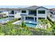 Beautiful backyard featuring a pool and spa, surrounded by lush landscaping and a privacy fence at 1080 E Jack Nicklaus Ct, Kissimmee, FL 34747