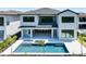 Stunning two-story home featuring a private pool, spa, and an expansive outdoor living space at 1080 E Jack Nicklaus Ct, Kissimmee, FL 34747