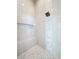 Modern shower stall with stylish tile design, built-in bench, and accent wall at 1080 E Jack Nicklaus Ct, Kissimmee, FL 34747