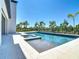 Beautiful backyard swimming pool with a spa and a sun shelf at 1080 E Jack Nicklaus Ct, Kissimmee, FL 34747