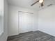 Neutral bedroom with wood-look floors, ceiling fan, and large closet at 12388 Se 106Th Ave, Belleview, FL 34420