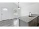 Updated kitchen features granite counters and a breakfast bar, perfect for casual dining at 12388 Se 106Th Ave, Belleview, FL 34420