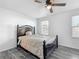 The bedroom has a ceiling fan, luxury vinyl plank flooring, and a closet at 12388 Se 106Th Ave, Belleview, FL 34420