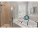 Bathroom with walk-in shower, soaking tub, and neutral finishes at 128 Lake Region Cir, Winter Haven, FL 33881