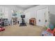 Well-lit bedroom includes carpeted floors, two closets, and ample space for play at 128 Lake Region Cir, Winter Haven, FL 33881