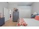 Bedroom with neutral decor, closet, large window and unique accent furniture at 128 Lake Region Cir, Winter Haven, FL 33881
