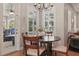 A breakfast nook with natural light and views, great for casual dining near pool at 128 Lake Region Cir, Winter Haven, FL 33881