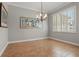Spacious formal dining area featuring tile floors, neutral paint, and natural light at 128 Lake Region Cir, Winter Haven, FL 33881