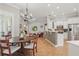 Open kitchen and dining area boasts tile flooring, modern appliances, and stylish countertops at 128 Lake Region Cir, Winter Haven, FL 33881