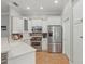 This modern kitchen is equipped with stainless appliances, sleek cabinetry, and tile flooring at 128 Lake Region Cir, Winter Haven, FL 33881