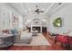 Spacious living room featuring hardwood floors, fireplace, and ample seating at 128 Lake Region Cir, Winter Haven, FL 33881