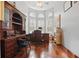 Bright home office with wood floors, built-in shelving and beautiful natural light at 128 Lake Region Cir, Winter Haven, FL 33881