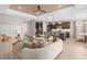 Open-concept living room featuring an island, comfortable seating, and stylish decor in a modern layout at 1302 Nestled Valley Rd, Minneola, FL 34715