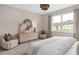 The main bedroom features a large window providing ample natural light and scenic views at 1302 Nestled Valley Rd, Minneola, FL 34715