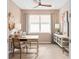 Airy home office setup with modern desk, storage console and great lighting at 1302 Nestled Valley Rd, Minneola, FL 34715