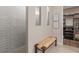 Bench seat beside the glass enclosed shower, located next to the walk-in closet at 1302 Nestled Valley Rd, Minneola, FL 34715