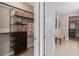 View into the walk-in closet with custom shelving and drawers to maximize storage space at 1302 Nestled Valley Rd, Minneola, FL 34715