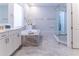 Luxurious bathroom boasts a soaking tub, dual vanities, and a glass-enclosed shower with designer tile at 13125 Casabella Dr, Windermere, FL 34786